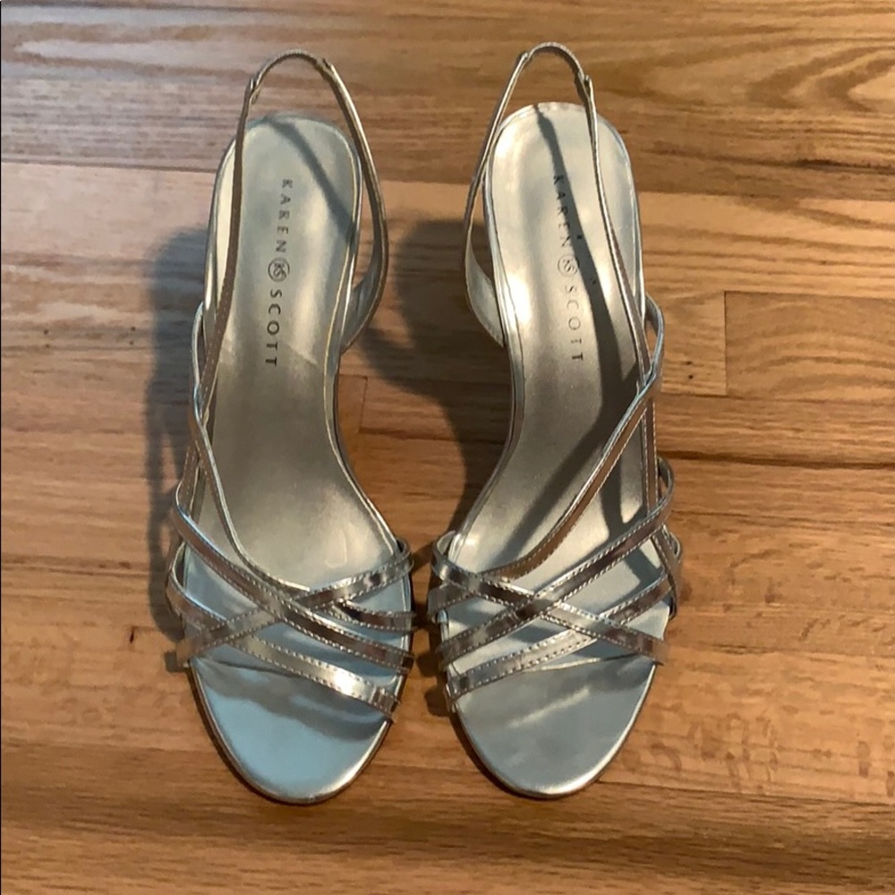 Silver strappy high heels.
